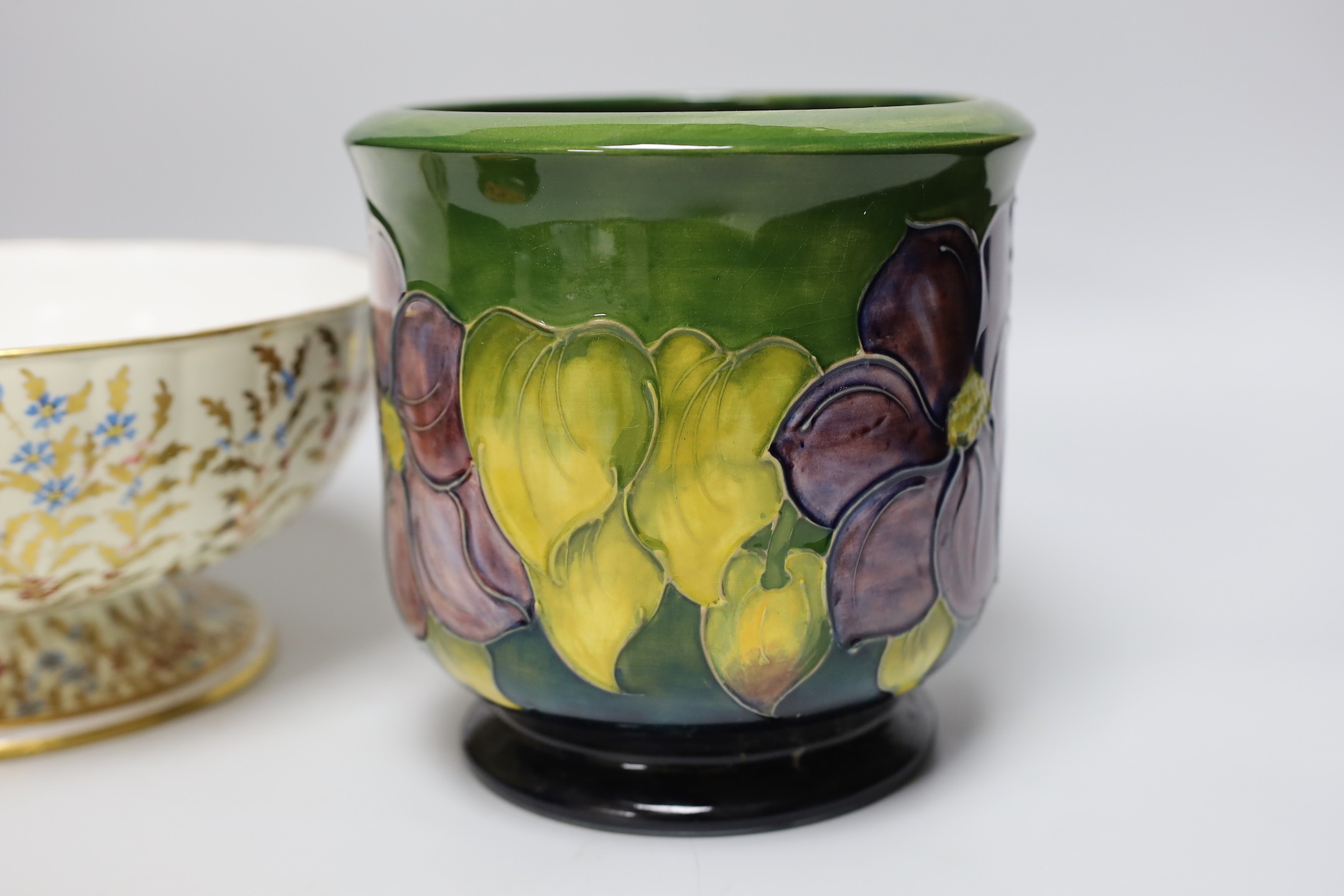 A Moorcroft Hibiscus jardiniere, an odd Moorcroft cover and Wedgwood pedestal fruit bowl, jardiniere 18cms high